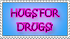 Stamp; black text with a pink border reads: 'HUGS FOR DRUGS!'. The background of the stamp is a soft light blue